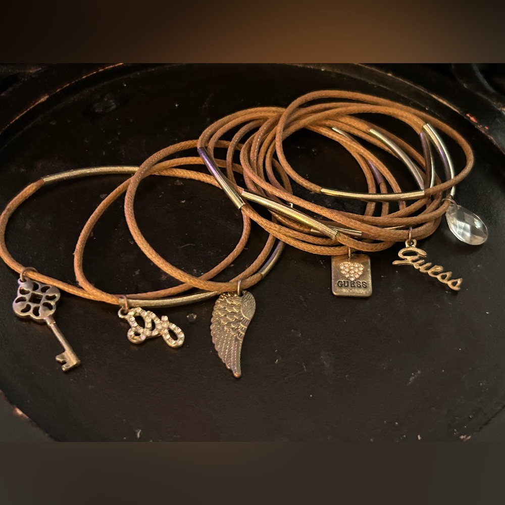 Guess brand bracelets, brown leather- 6 plain leather and 6 with guess charms